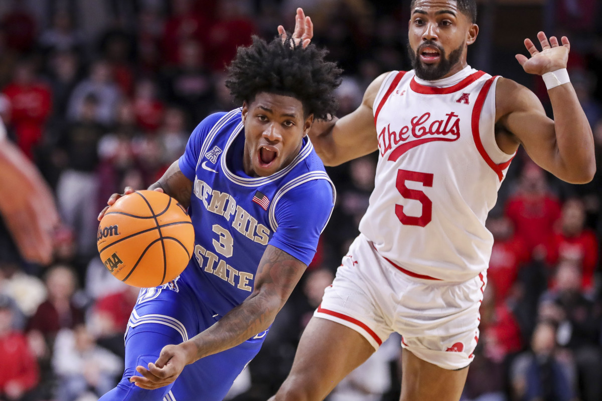 Jan 22, 2023; Cincinnati, Ohio, USA; Memphis Tigers guard Kendric Davis (3) dribbles past Cincinnati Bearcats guard David DeJulius (5) the second half at Fifth Third Arena. Mandatory Credit: Katie Stratman-USA TODAY Sports